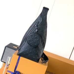 Sling Bag in Embossed Monogram Leather with Circular Pouch