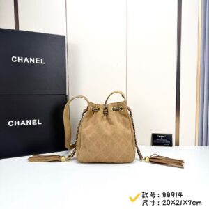 Quilted Suede Bucket Bag: Tassel & Chain Accents in Neutral Finishes