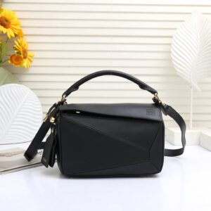 Puzzle Small Top-Handle Bag – Structured Leather with Signature Anagram Branding (Modern Luxury Statement)